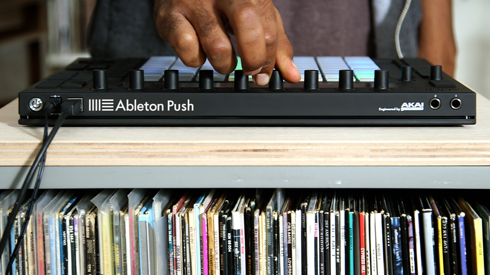 Ableton Push controller above some old vinyl